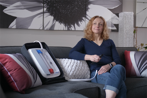 picture of woman sitting on sofa with AKTIV prototype artificial kidney