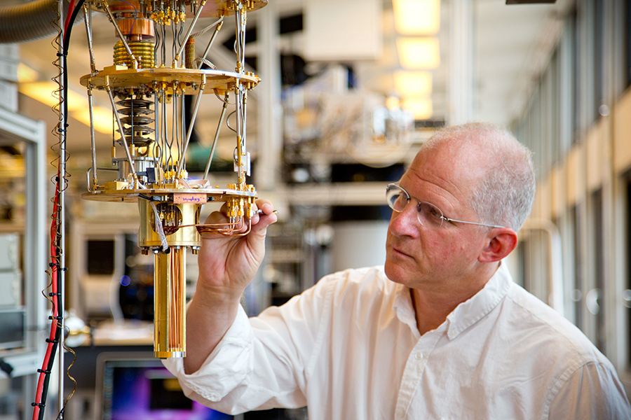 Professor Charles Marcus makes adjustments on equipment in his lab at the Niels Bohr Institute in Copenhagen, Denmark. 