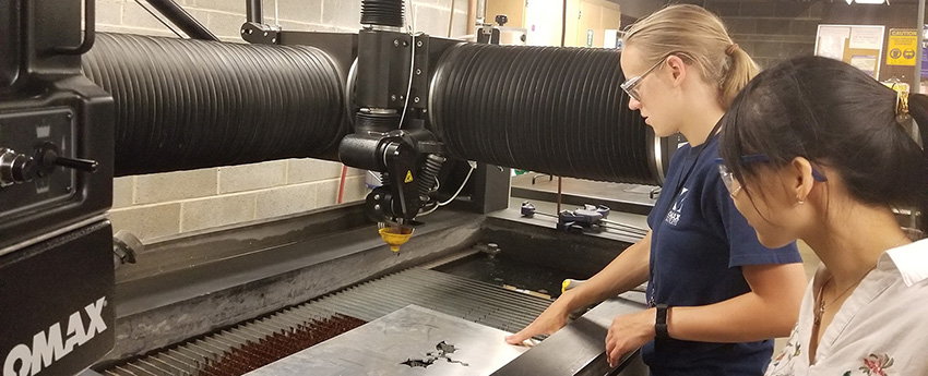 Student using machine shop equipment