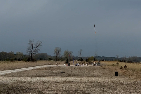 The UW FNL team's rocket launches into an overcast Wisconsin sky