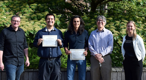 George Fennell holds the certificate for his CEI outreach award